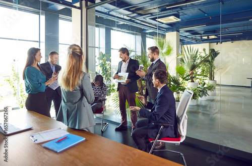 Fotografija Businessman conducts a meeting or presentation for a team of office staff