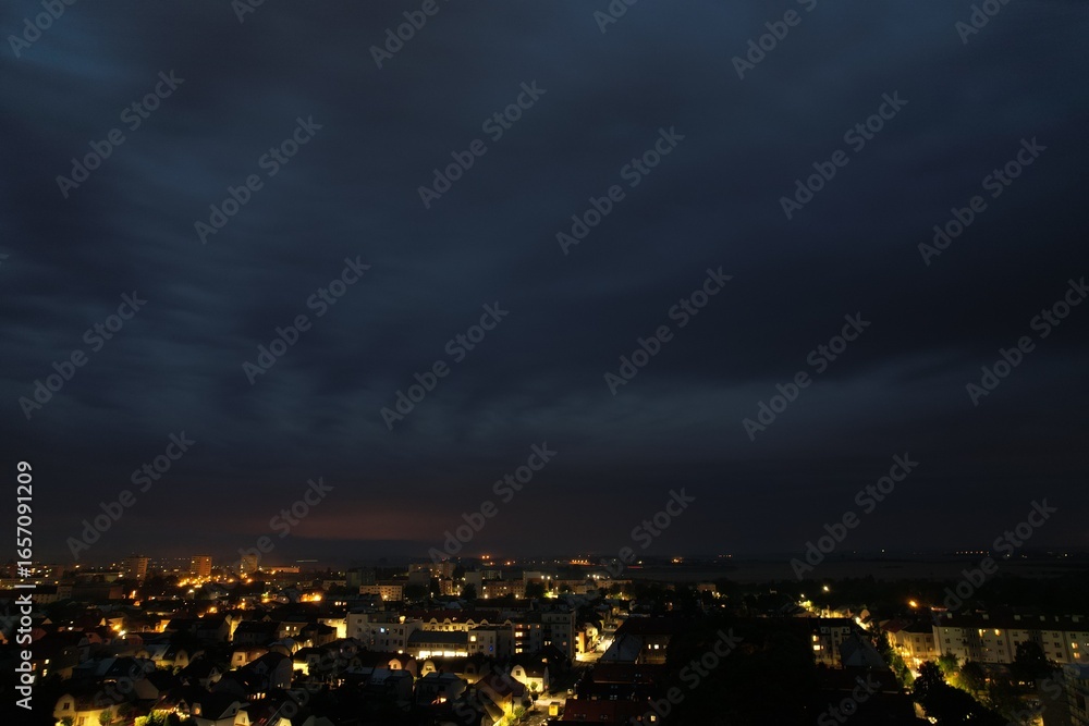 Fototapeta premium Thunderstorm with lightning above Nymburk town captured during night