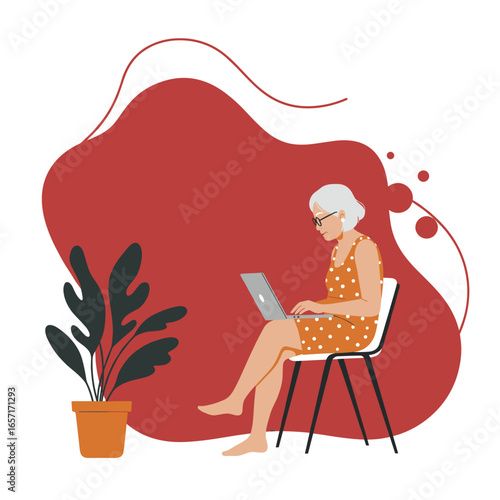 Active senior woman engaged with a laptop at home, representing modern digital life, remote work, online learning, and connectivity.
