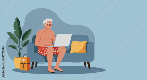 Senior man in swim shorts relaxing on a couch using a laptop, symbolizing remote work, digital nomad lifestyle, and travel planning.