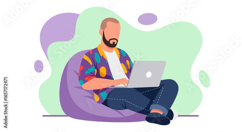 A man comfortably working on his laptop in a relaxed setting, ideal for remote work, freelance, or online learning concepts. Modern digital lifestyle.