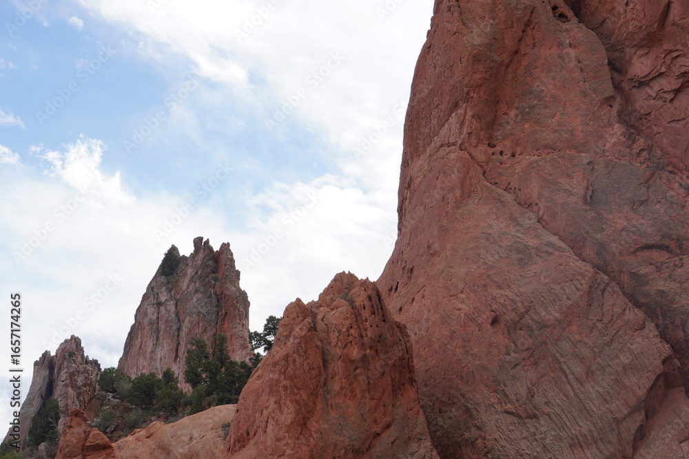 Fototapeta premium Two Massive Red Rock Formations Reaching the Sky