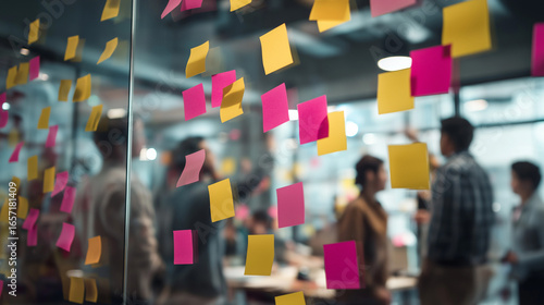 startup meeting, creative team working with sticky notes on glass wall