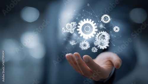 Interconnected gears in hand, symbolizing system optimization and process improvement
