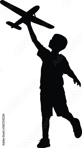 Silhouette of Boy Holding Toy Airplane in the Air
