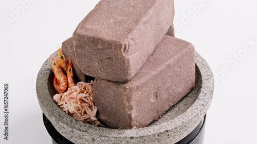 Traditional Indonesian Shrimp Paste Terasi on mortar stone