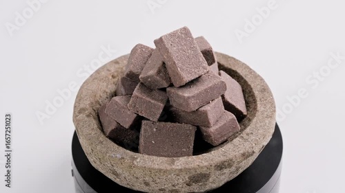 Traditional Indonesian Shrimp Paste Terasi on mortar stone