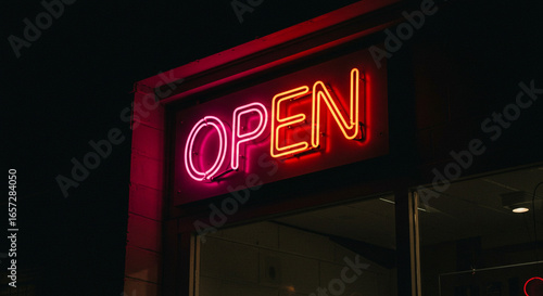 Wallpaper Mural Vibrant neon OPEN sign glows invitingly in the dark, signaling business readiness and welcome Torontodigital.ca
