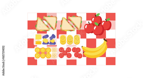 An overhead view of a picnic spread with sandwiches, fruit, and snacks on a red checkered blanket.