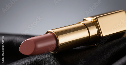 Luxury Lipstick with Golden Case on Black Satin Background – Elegant Beauty Product Photography