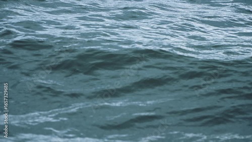 Water surface background. Lake with big waves on a windy day