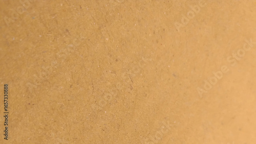 Background of brown kraft paper or cardboard texture. old paper sheet, parchment or papyrus surface.