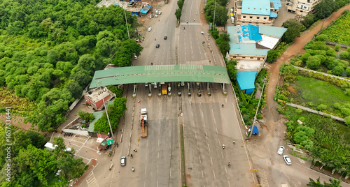 Obraz na płótnie aerial view of highway toll plaza, drone shot of indian toll gate, expressway toll collection point, transport infrastructure on highway stock photo