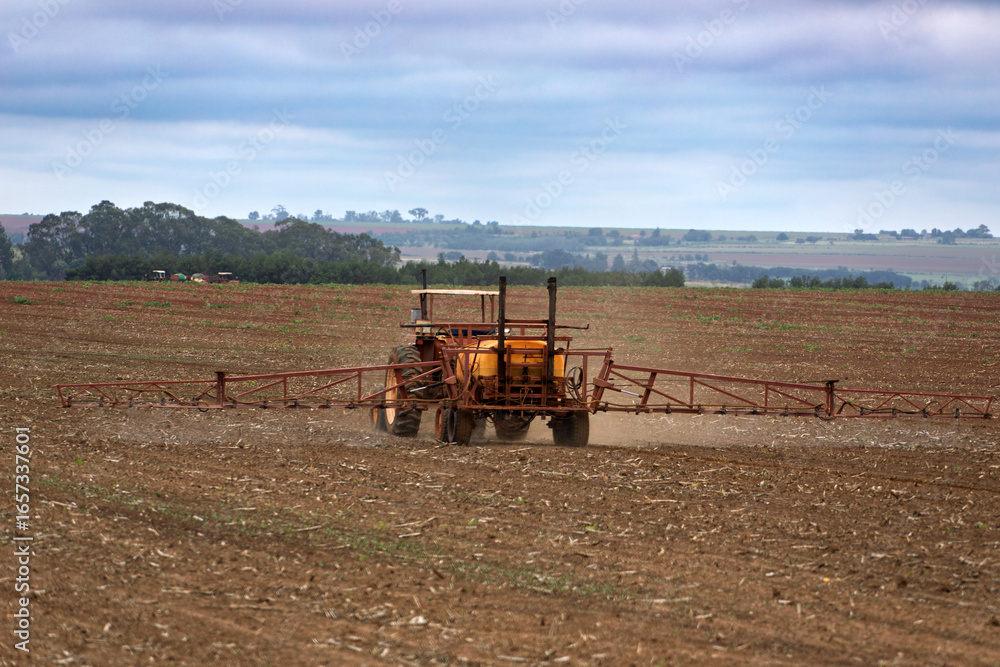Fototapeta premium tractor spray tank , efficient dispensing chemicals pesticides, modern agriculture in the field, rural communities,