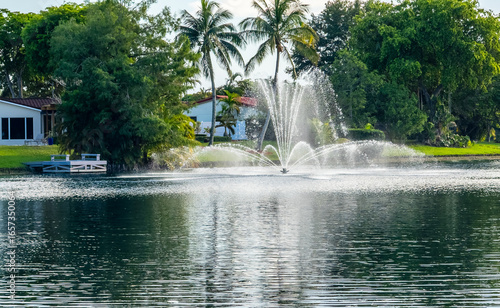 A fountain feature in a typical residential lake in Miami Lakes, Florida, USA.