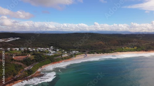 Wallpaper Mural Wide ocean establishing of Catherine Hill Bay beach and clear blue sea horizon in New South Wales, aerial pullback of coastline Torontodigital.ca