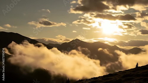 Golden Sunset Over Majestic Mountains and Rolling Clouds Scenic Landscape View