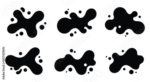 Black ink splatters on white background in various shapes and sizes silhouette