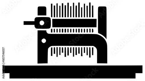 weaver tool on a table with threads and yarn near a loom in a workshop room