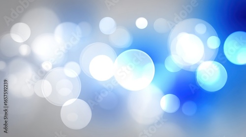 Abstract blue bokeh lights background with glowing orbs and soft glow effects.