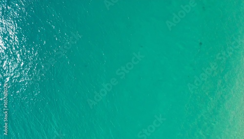 High-angle view of tranquil turquoise water exhibiting subtle surface textures.