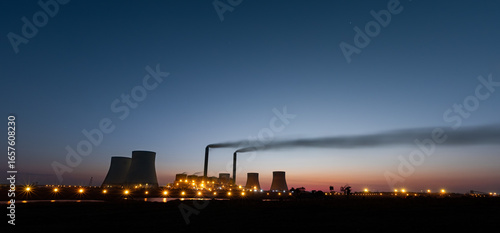 Industrial Power Plant at Dusk with Smoke Emissions