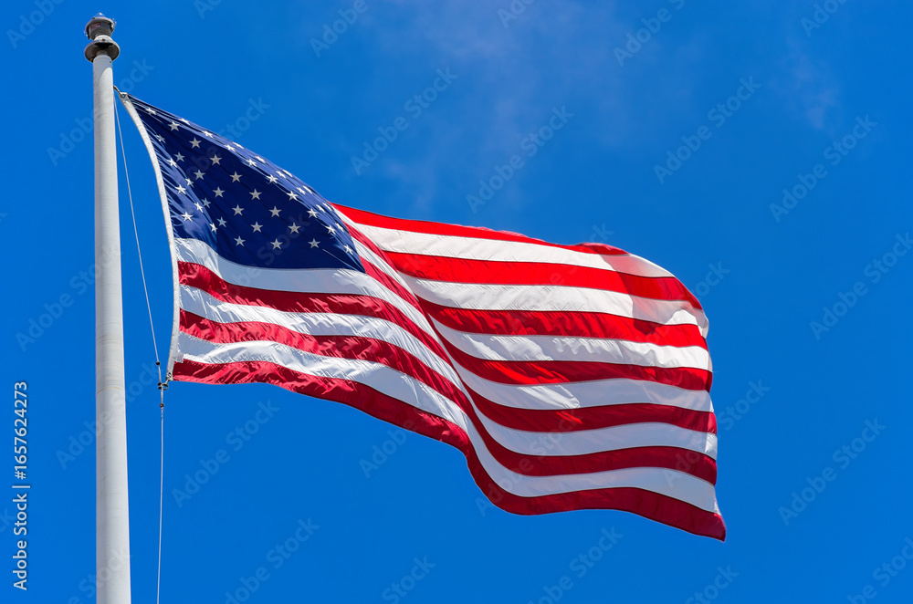 Fototapeta premium American Flag Waving Blue Sky Monterey California