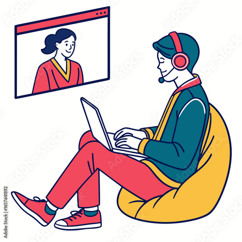Person with headset on beanbag chair video calling colleague laptop communication