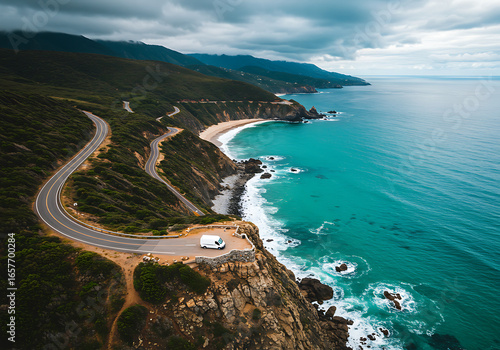 Fototapeta Naklejka Na Ścianę i Meble -  Aerial view of a camper van on a scenic coastal road by the sea