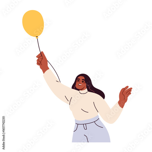 Happy black woman holding helium balloon, smiling with joyful carefree expres...