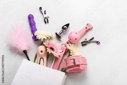 Paper bag with sex toys and...