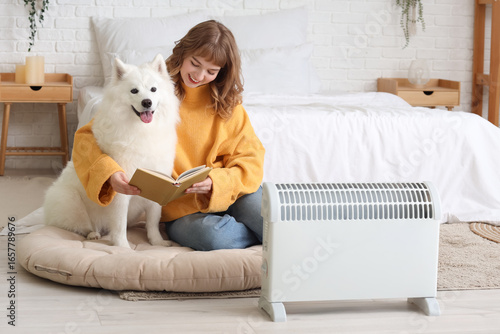 Young woman with cute dog r...