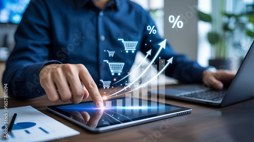 Man using tablet with digital growth chart and shopping carts showing online sales increase