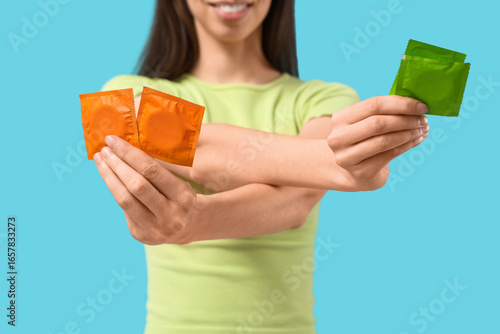 Young woman with condoms on...