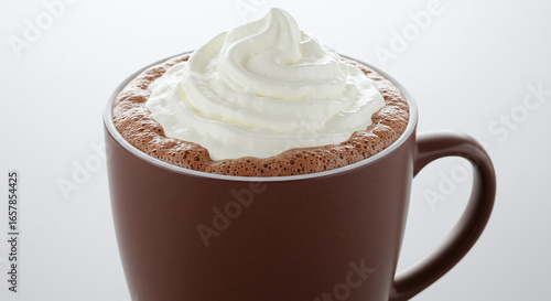 Close-up of a steaming mug of rich hot chocolate topped with a generous swirl of fluffy whipped cream, perfect for a cozy winter day or a sweet treat.
