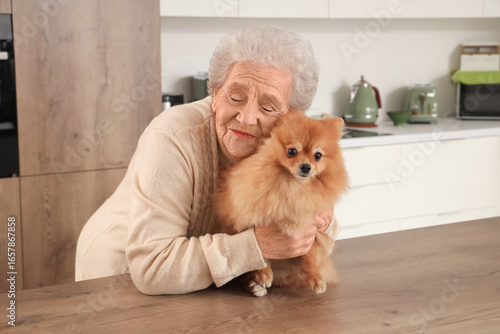 Senior woman hugging Pomera...