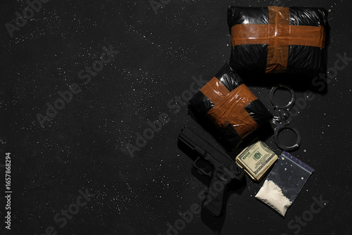 Drug packages with gun, mon...