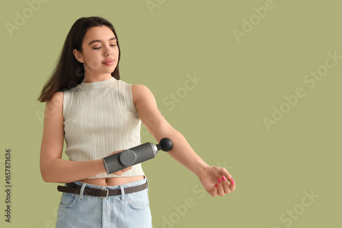 Young woman massaging her a...