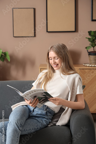 Young pretty woman reading ...