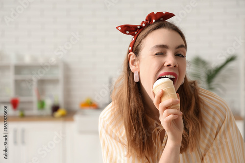 Young woman biting vanilla ...