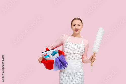 Pretty young woman holding ...