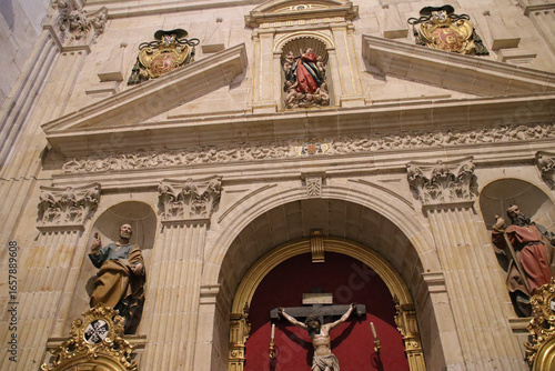 Fototapeta sculpted altarpiece in a chapel in the church of the st stephen (or san esteban)