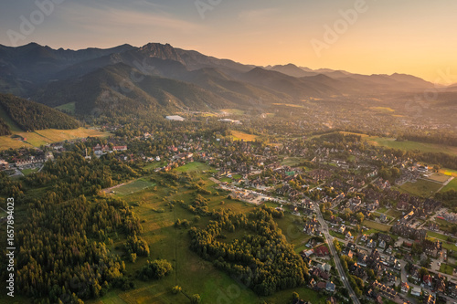Tatras from above – drone photo of Zakopane surroundings with majestic mountain peaks, forests and open sky. Ideal for travel, adventure and scenic landscape photography.