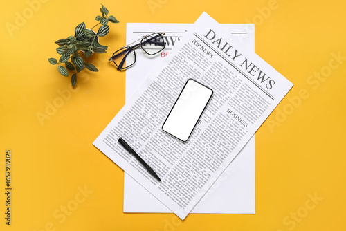 Newspapers, eyeglasses, mob...