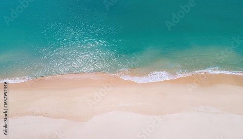 Seaside Tranquility: Aerial view of the pristine coastline, capturing the rhythmic dance of waves gently caressing the sandy shore, an ode to the natural beauty of the coastal environment.