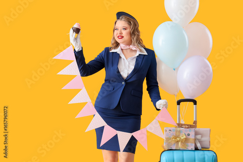 Young happy stewardess with...