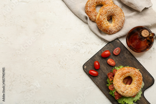 Wooden board of tasty bagel...