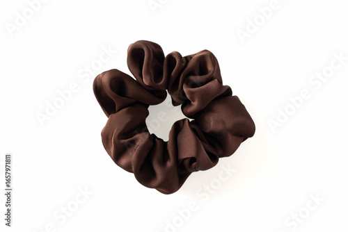 Dark brown fabric hair scrunchie isolated on white background, close-up. Aesthetic hair care accessories