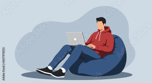 Relaxed person working on a laptop while sitting comfortably on a bean bag chair at home. Ideal for remote work, study, or leisure concepts.