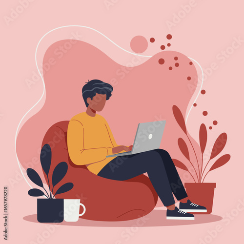 Person focused on remote work, studying, or freelancing from a cozy home environment using a laptop on a comfortable bean bag chair.